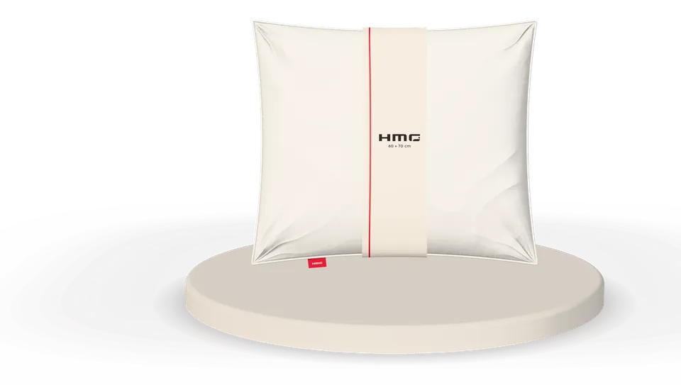 A pillow with a woven label and a retail band, ready for your own brand